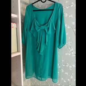 Boutique sea foam green chiffon shift dress with bow back detail.
